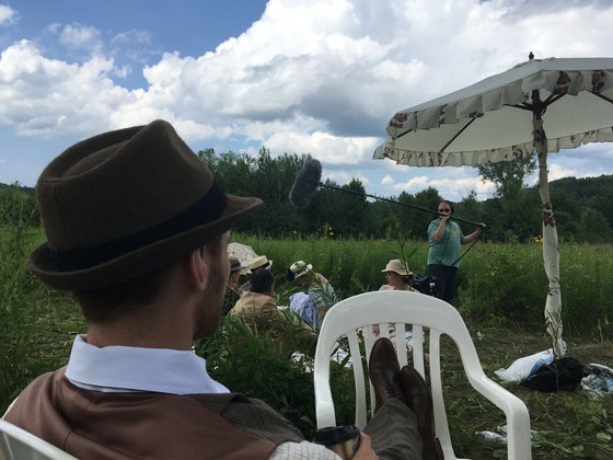 Crew and lighting equipment at an outdoor location