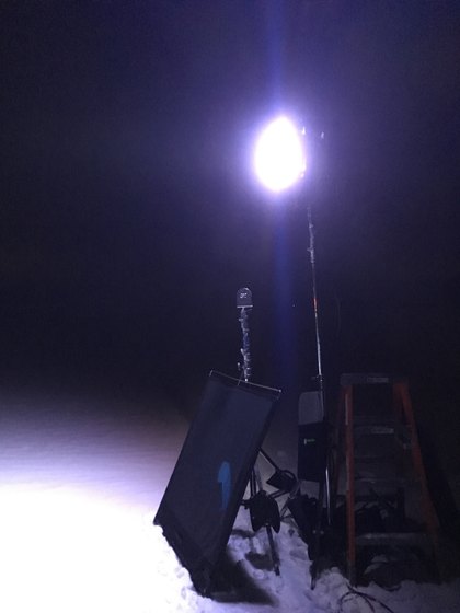 An elevated light illuminating a night location