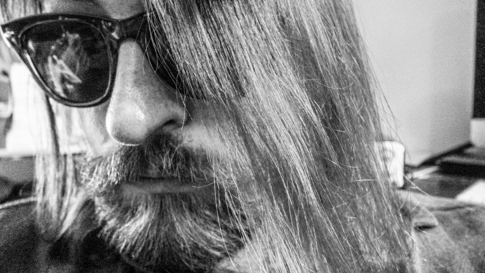 Black-and-white portrait of Matt Porter in sunglasses.
